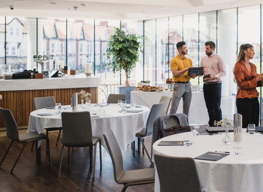 People discussing whilst having a corporate catering in singapore